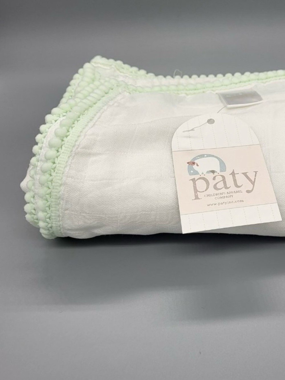 PATY Pom-Pom Trimmed Blanket